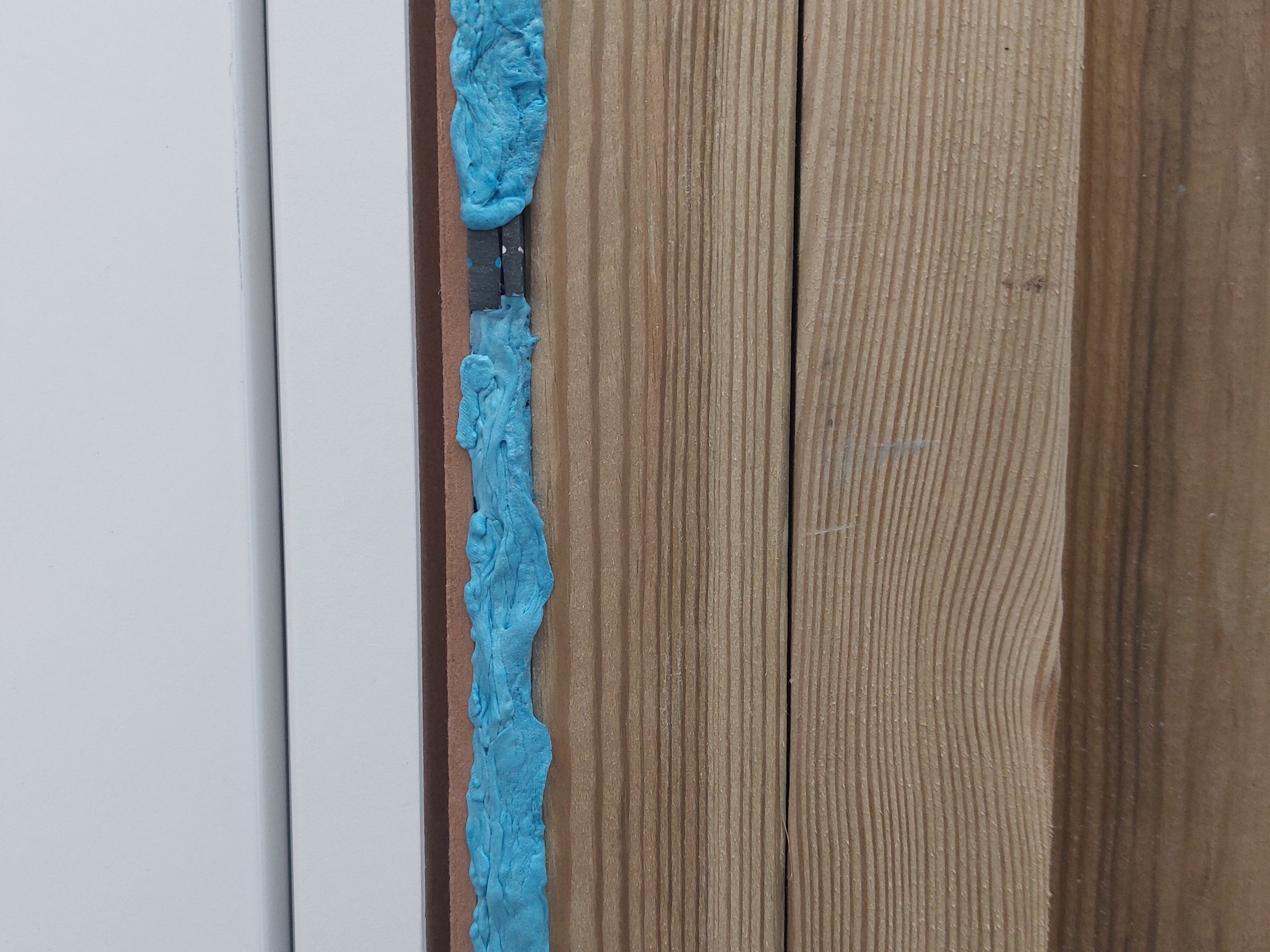 Fire rated foam that has been used to seal a fire door.